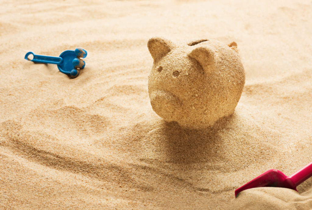 piggy bank made of sand